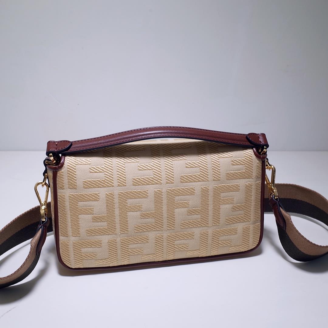 The FEND1 iconic Baguette handbag is made of beige canvas material adorned with FF pattern emb