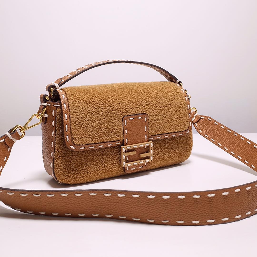 FEND1 signature medium Baguette handbag made of soft brown merino sheepskin with oversized han