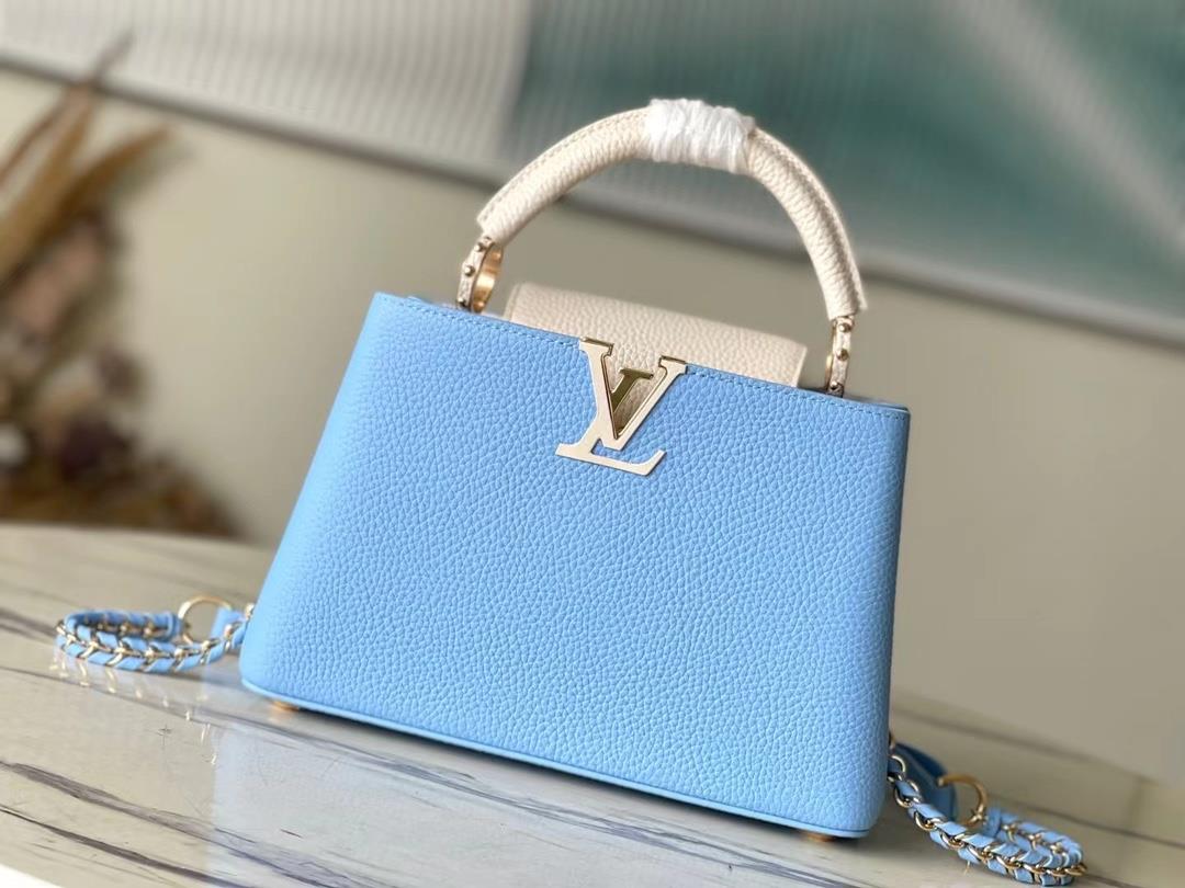 M21887 blue small size Taurilon leather version of the Capuchines handbag presents a soft and fresh