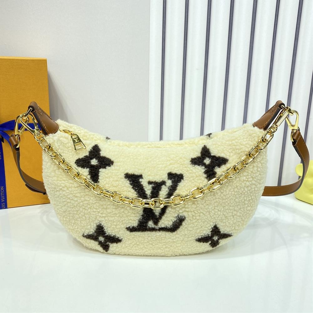 M23321 Over The Moon handbag Made of wool leather and cleverly integrated with a large contrasting Monogram pattern it is a great choice for winter b