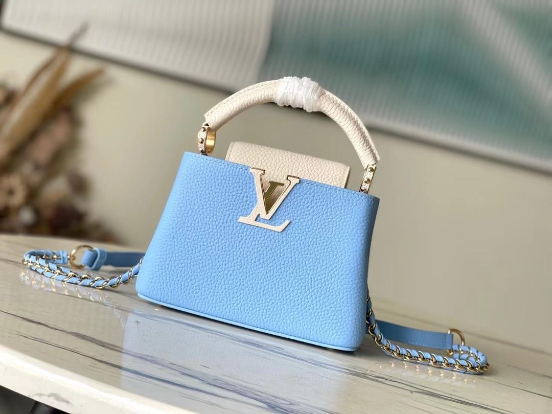 M21887 blue mini Taurilon leather version of the Capuchines mini handbag presents a soft and fresh c