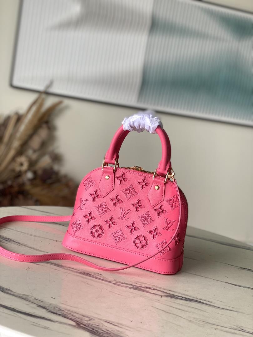 M22878 red 91606 perforated redThis Alma BB handbag originates from the LV Broderie Anglai