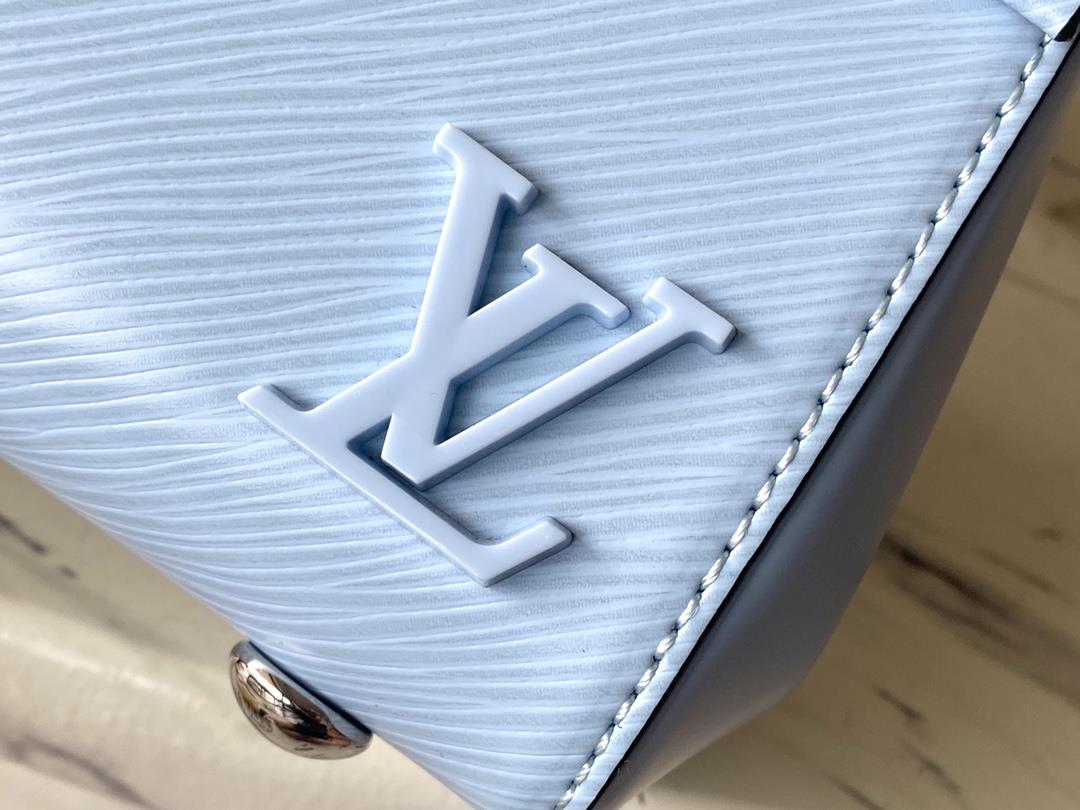 M22617 58931 Sky Blue This Cluny mini handbag conveys a fresh summer style with the unique