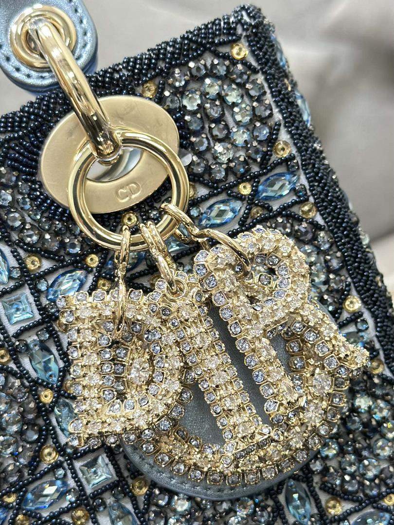 The limited edition of Lady Dior features four embroidered rhinestone blue accents and importe