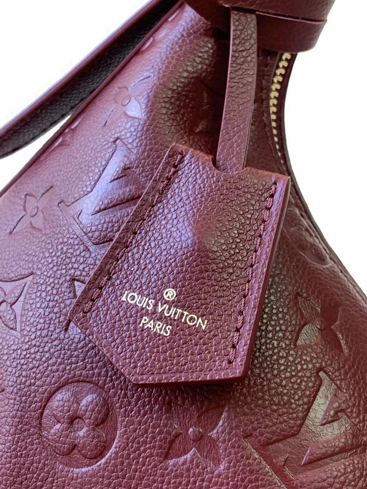 M46610 46609 The Sac Sport handbag is made of soft Monogram Imprente embossed leather with