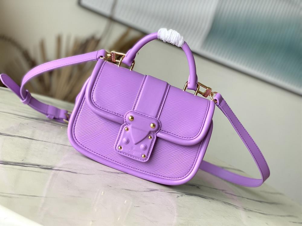 M22721 Taro PurpleThis Hide Seek handbag features Epi leather accents in bright tones featuring a Toron roller handle and leather wrapped lock buckle