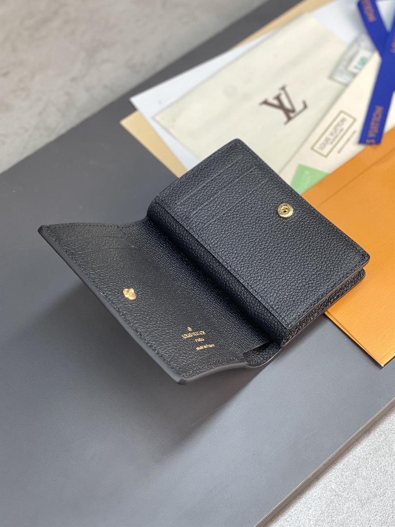 The M82370 black screen printed Cla wallet is made of Monogram Imprente soft grain cowhide