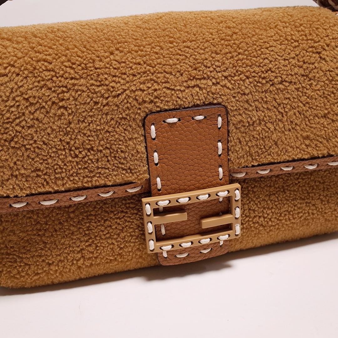 FEND1 signature medium Baguette handbag made of soft brown merino sheepskin with oversized han