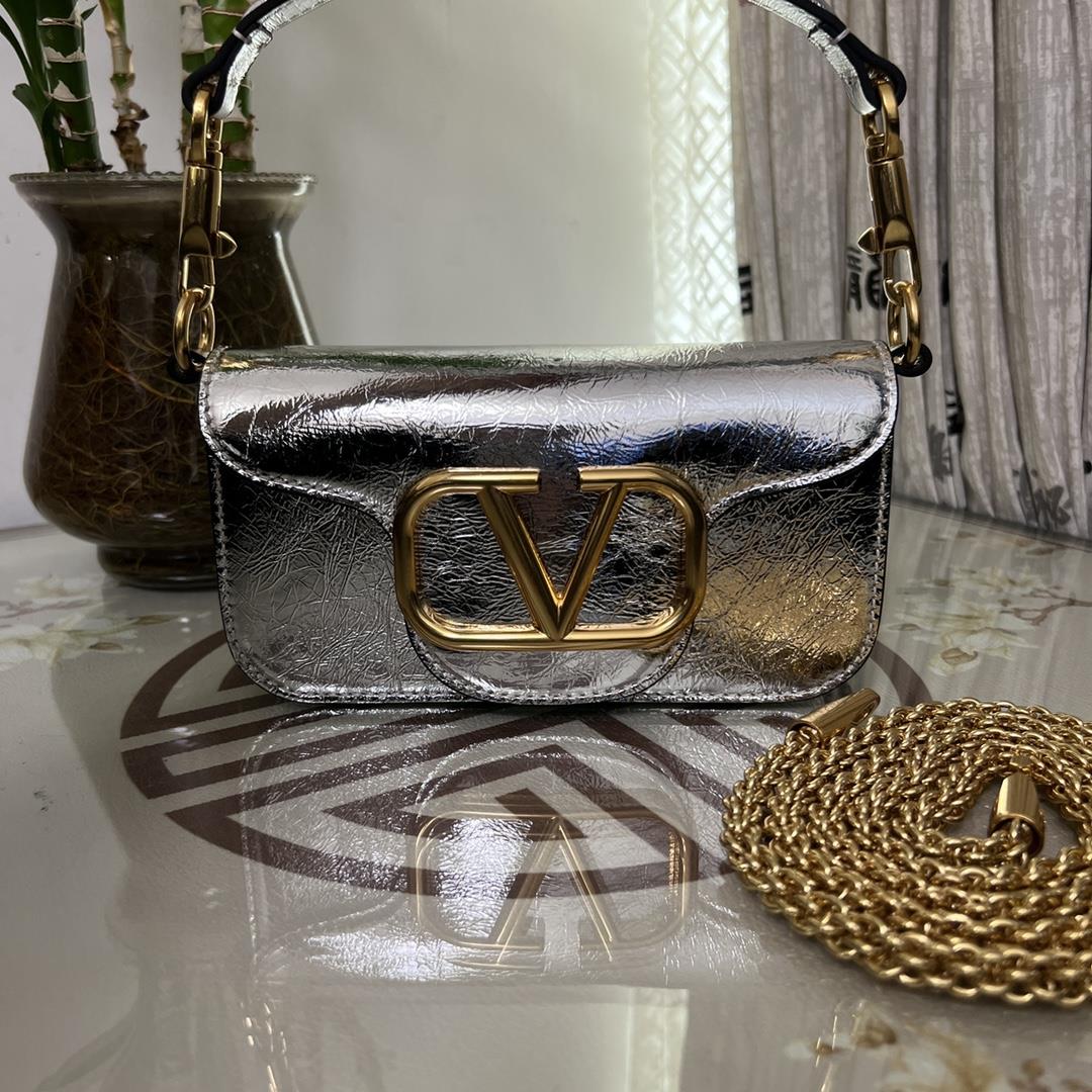 Small Garavani MINI LOC calfskin handbag with metal VLogo Signature detailsEquipped with detachable 