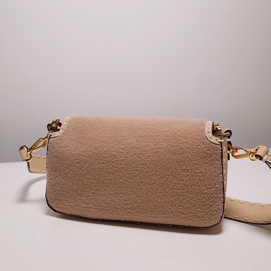 1080 FEND1 signature medium Baguette handbag made of soft pink merino sheepskin with oversized