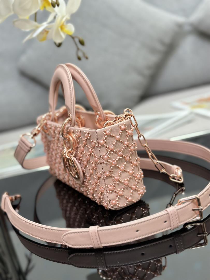 The Lady DJoy horizontal embroidery features half pearl rose gold and a sheepskin lining