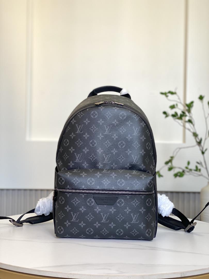 M22558 This Discovery Small Backpack is made from Monogram Eclipse canvas and continues its flexible