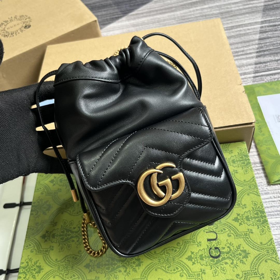 this mini bucket bag is crafted with black quilted Vshaped leather As a iconic element of the 