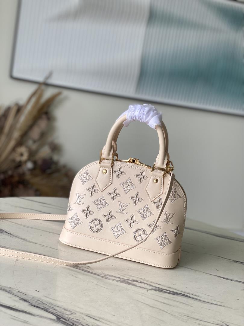 M22878 off white 91606 perforated off whiteThis Alma BB handbag originates from the LV Bro