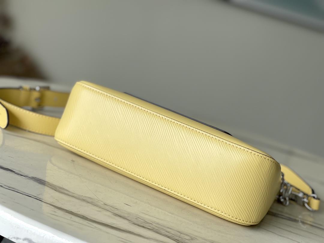 The M22215 Chicken Yellow Marelle handbag is crafted with elegant Epi grain leather to create 