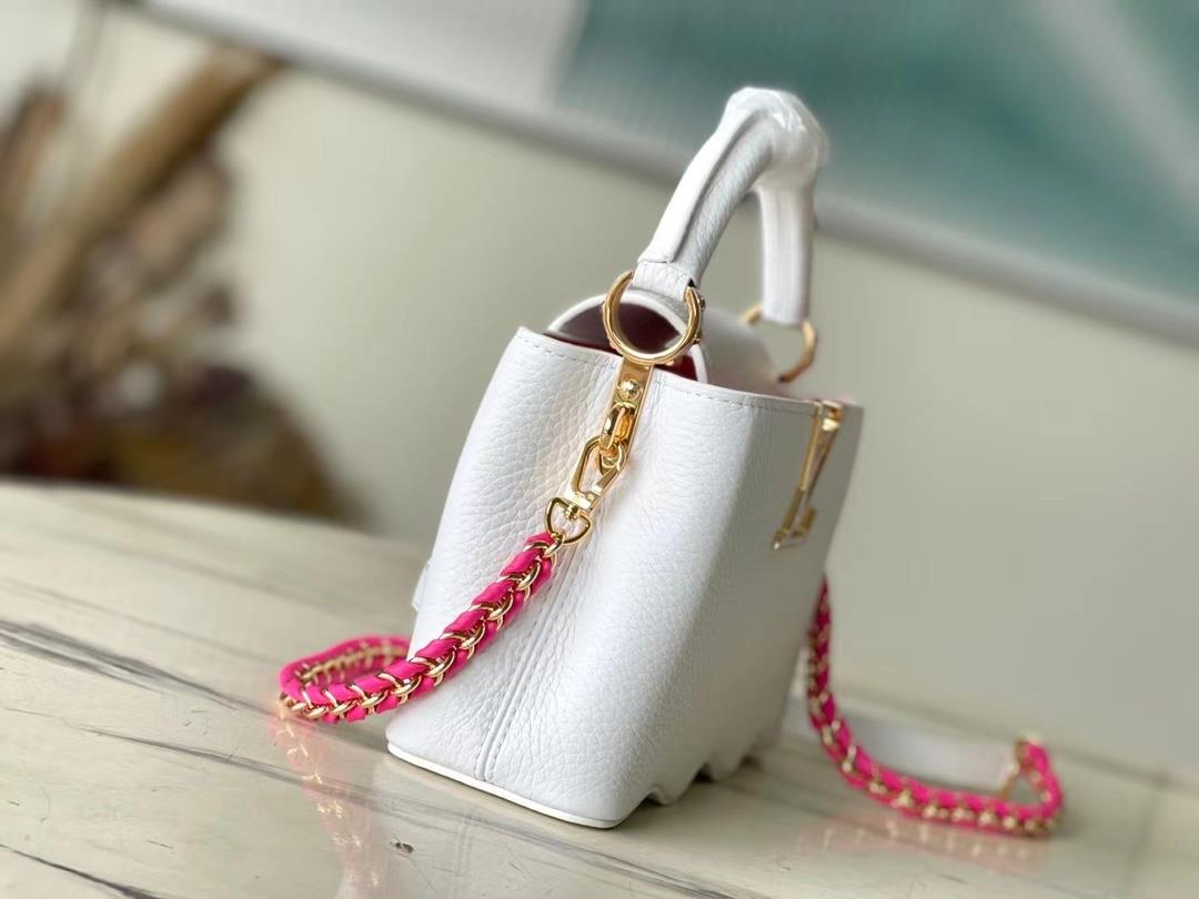 m22121 white mini capushell mini handbag is designed with a new capucines at the bottom of