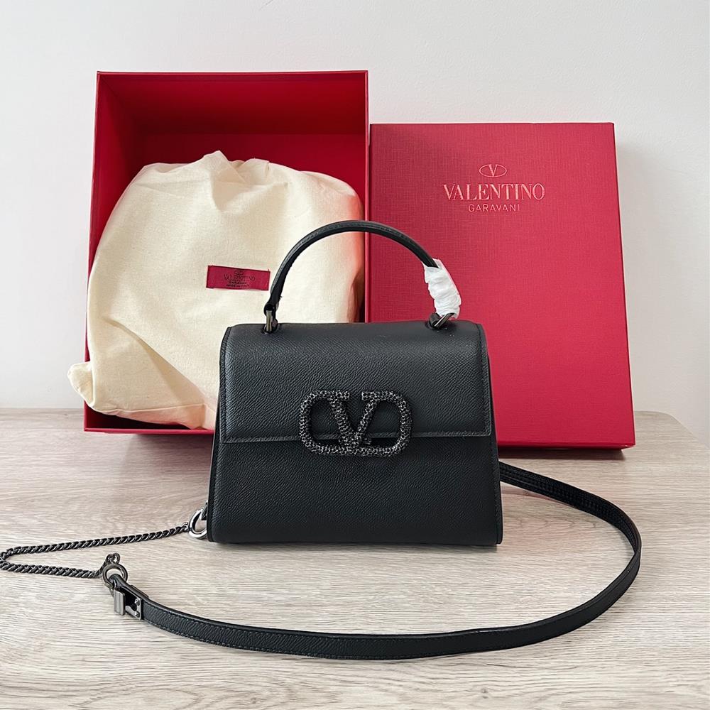 Mini Valentino Garavani VSLINGPaired with an extendable color matching shoulder strap and handle it allows for easy switching between shoulders cros