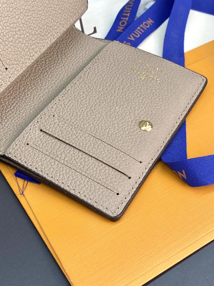 The M80515 Apricot Embossed Cla wallet is made of Monogram Imprente soft grain cowhide and