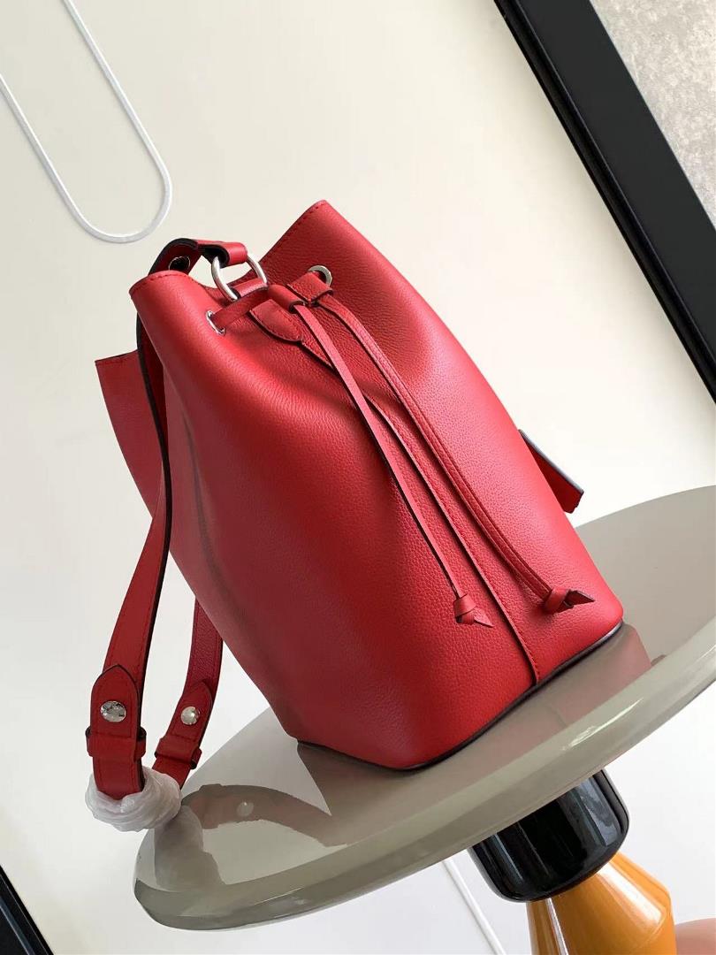 M54677s latest water bucket bag features imported soft calf leather with a shiny twist lo