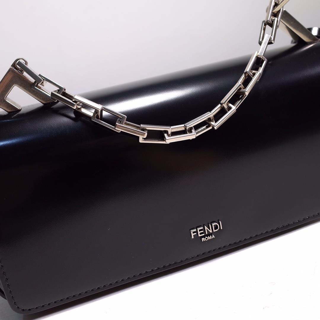 The FENDI handbag is made of black brushed leather material decorated with large F metal acces