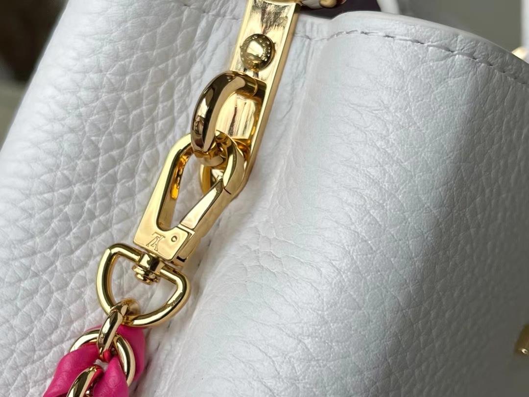 m22121 white mini capushell mini handbag is designed with a new capucines at the bottom of