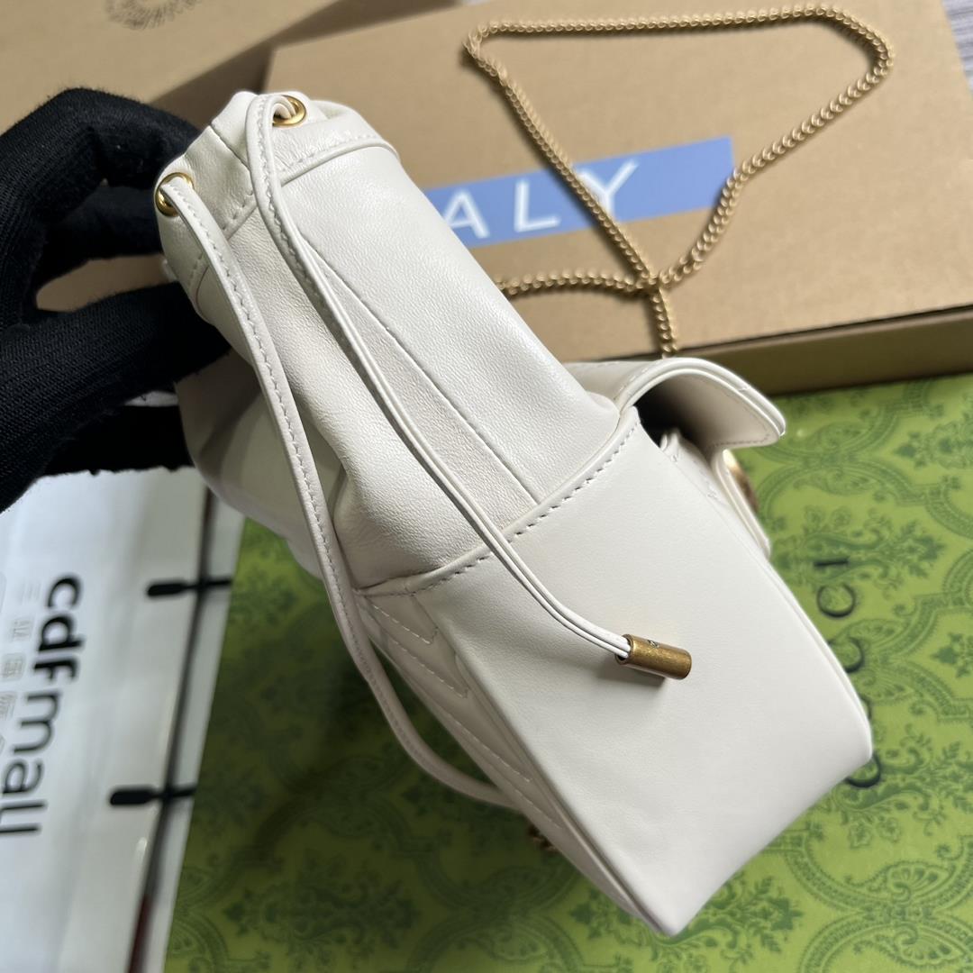 mini bucket bag is crafted with white quilted Vshaped leather As a iconic element of the GG Ma