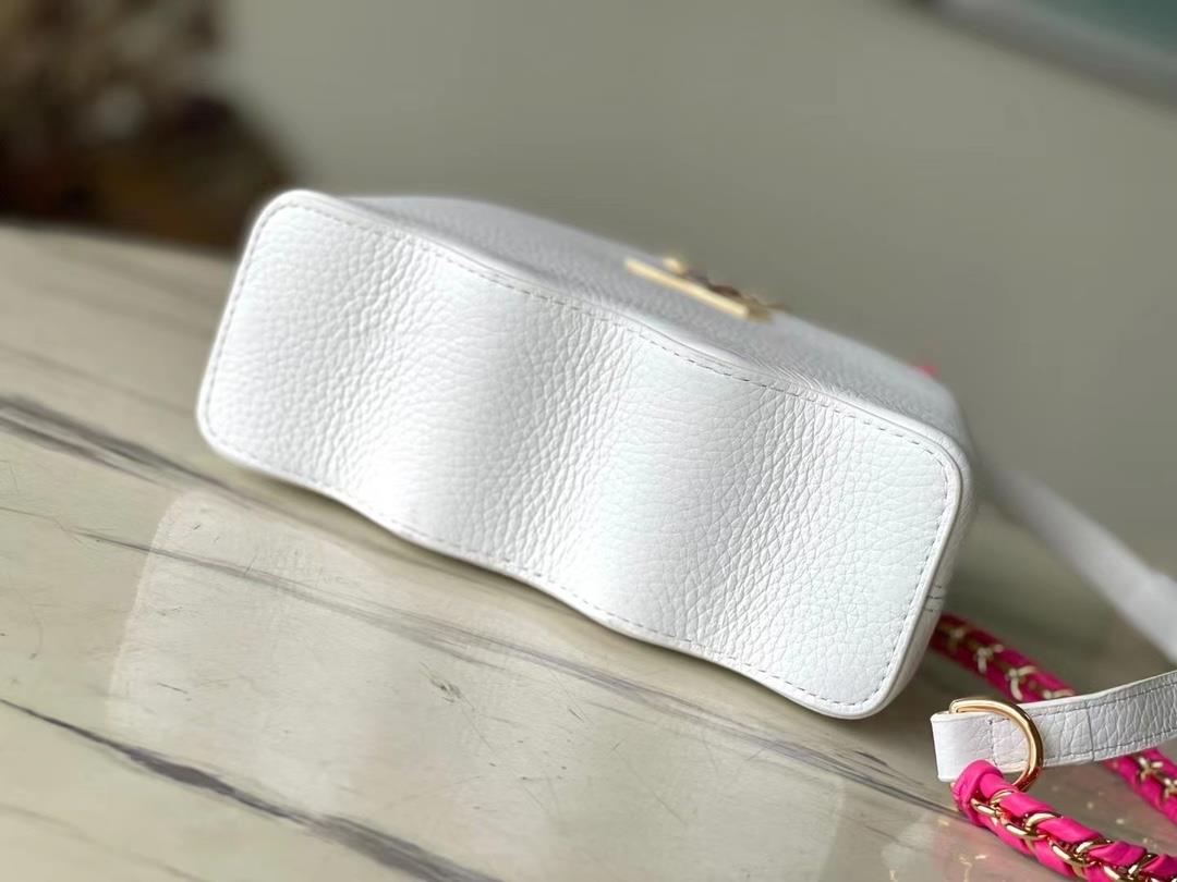 m22121 white mini capushell mini handbag is designed with a new capucines at the bottom of