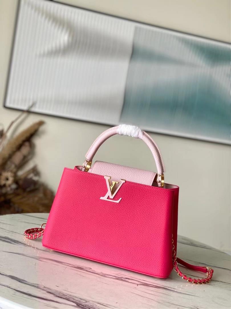 The toplevel original M21689 pink medium size Taurilon leather version of the Capuchines handbag pr