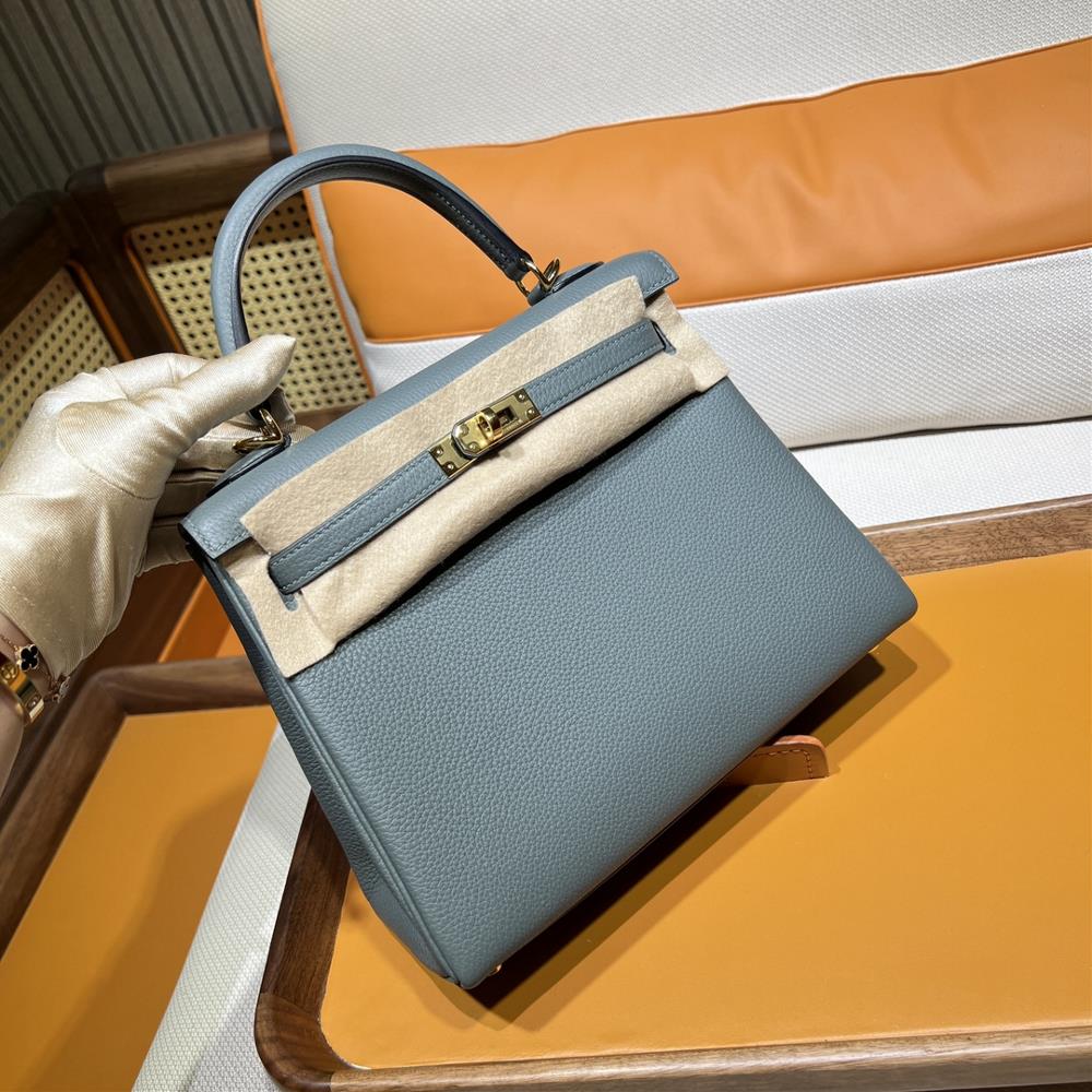 The Hermes Bag Kelly 25 Togo 63 in Almond Green is the epitome of timeless elegance and