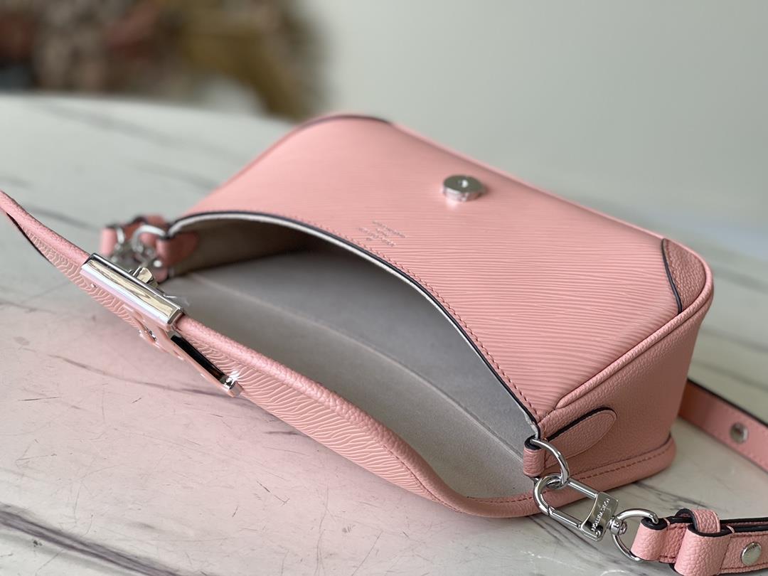 M2098759386 Peach Powder is a Buci crossbody bag made from iconic grain grain Epi leather This