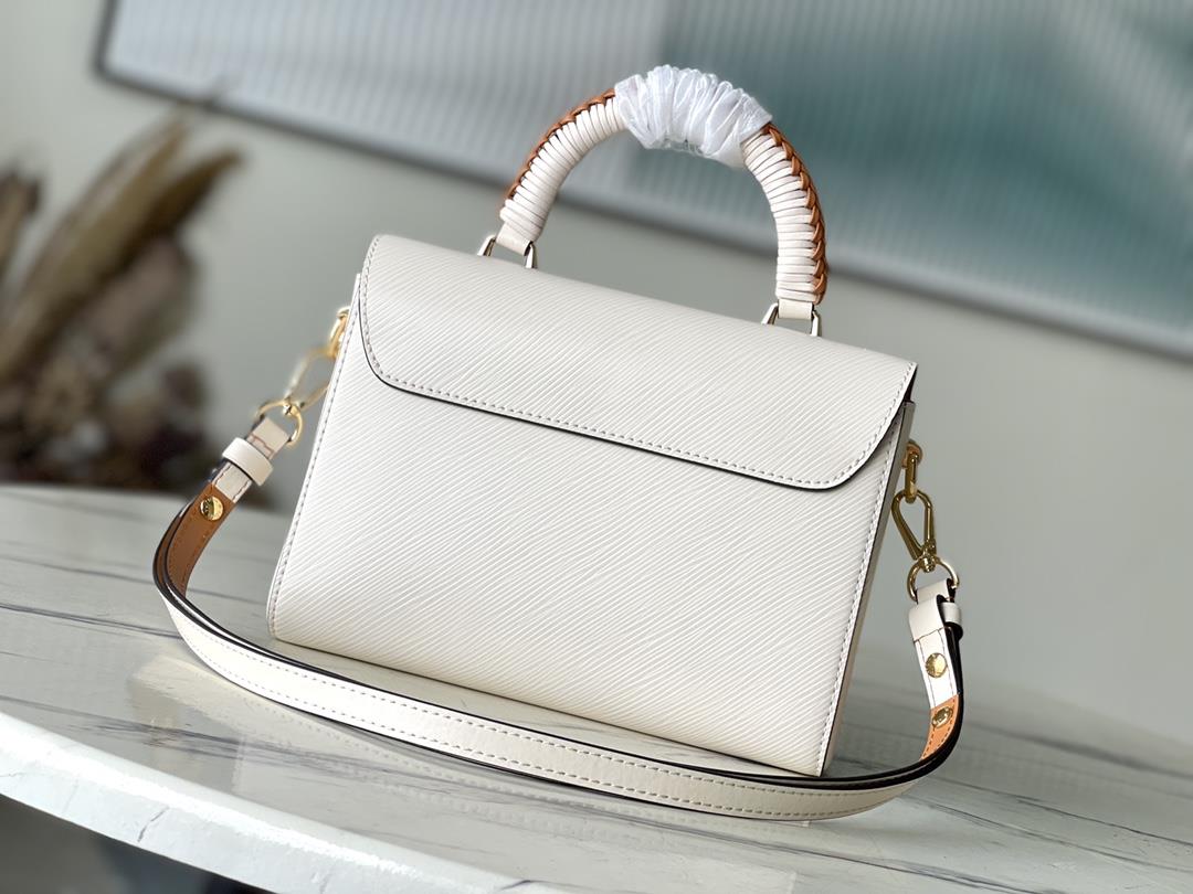 M22236 meter whiteThis Twist medium size handbag is made of Epi embossed leather wrapped