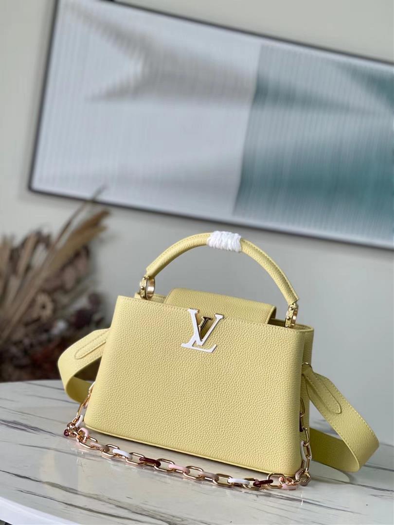 The toplevel original M21798 yellow medium size Capuchines medium size handbag is made of Taurillon 