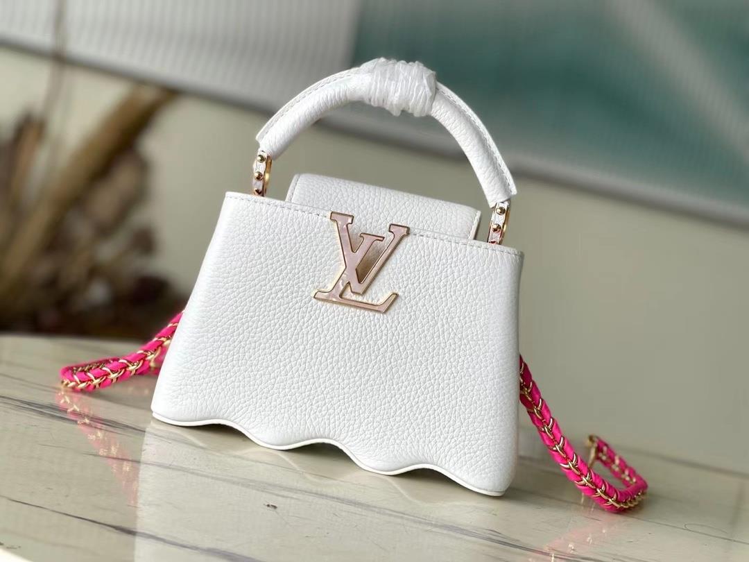 m22121 white mini capushell mini handbag is designed with a new capucines at the bottom of the wavy