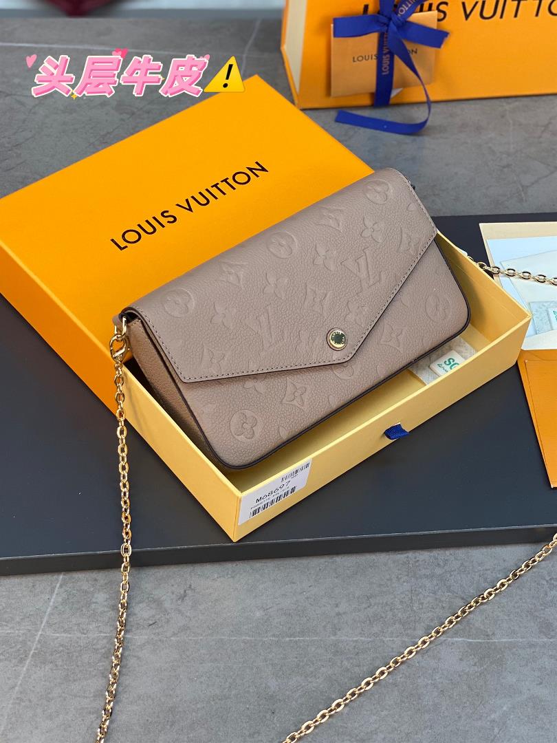 The M64064 Grey Pochette Flice Chain Bag is a Monogram Imprente leather embossed Louis Vuitton iconi