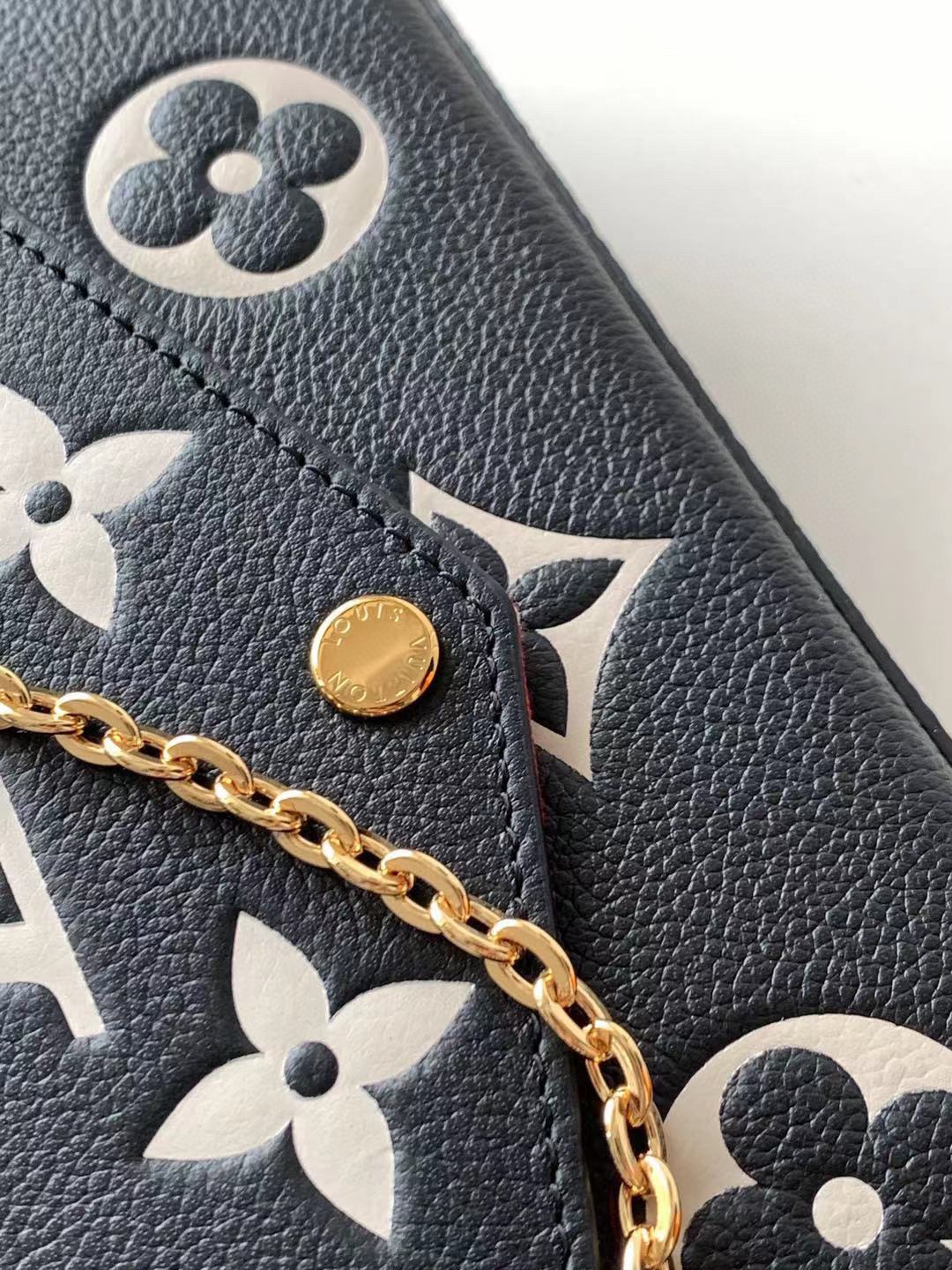 M61276 M64064 M64065 This Pochette F  licie chain bag features Monogram Imprente leather depic