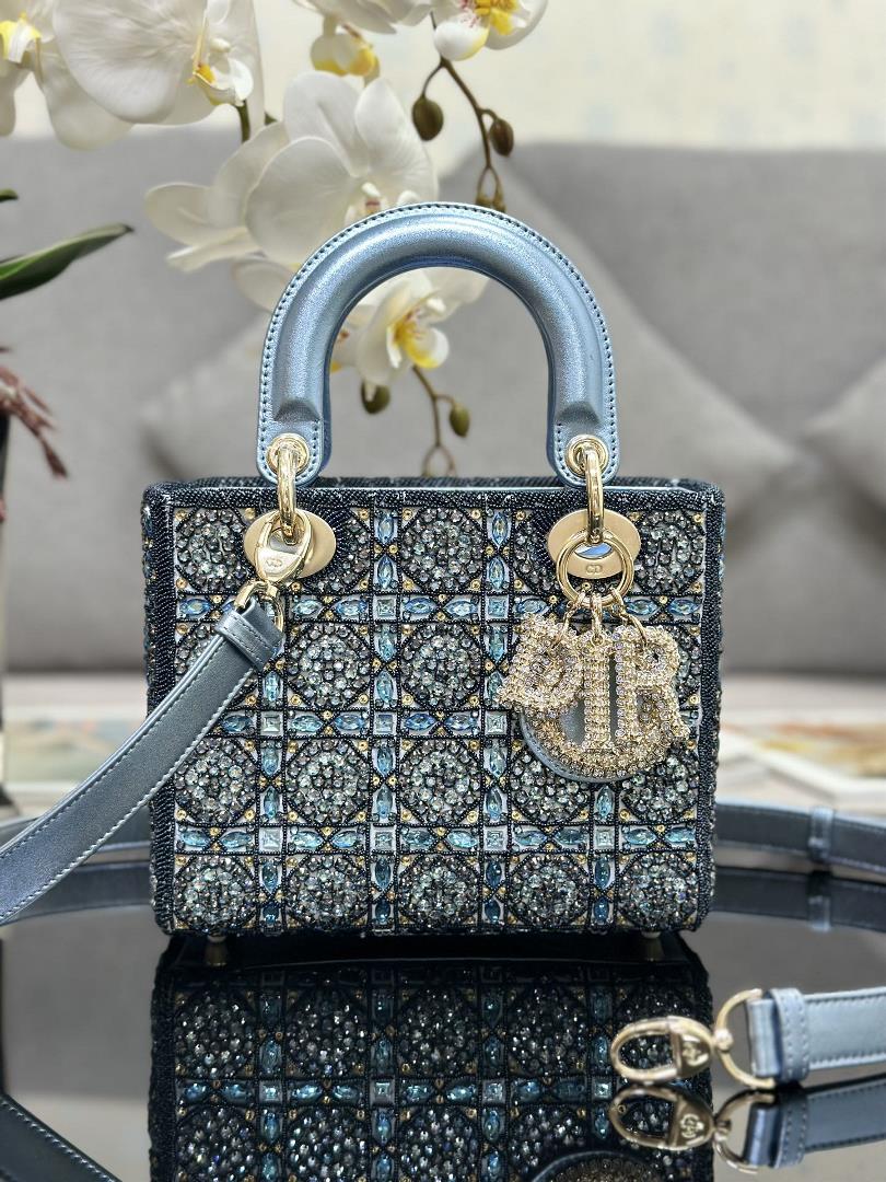The limited edition of Lady Dior features four embroidered rhinestone blue accents and imported shee