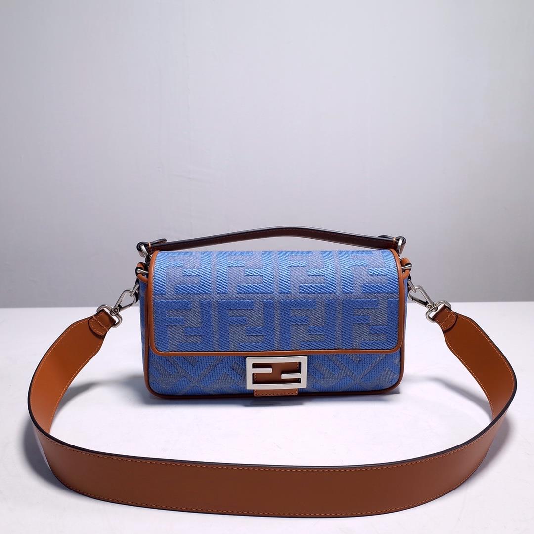 signature Baguette medium handbag made of Baby blue Denim decorated with the same color embossingF