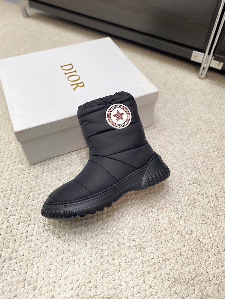 Dior Frost Ankle boots incorporate a high binding style showcasing a new skiing look The black quilted nylon shoe upper is adorned with rattan patt